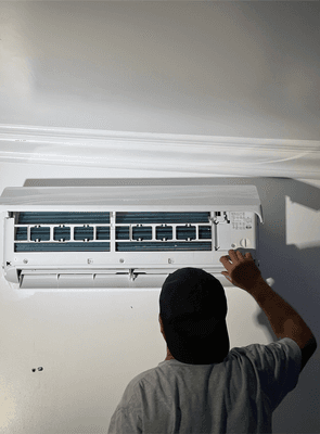 HVAC Technician installing a mini split system.