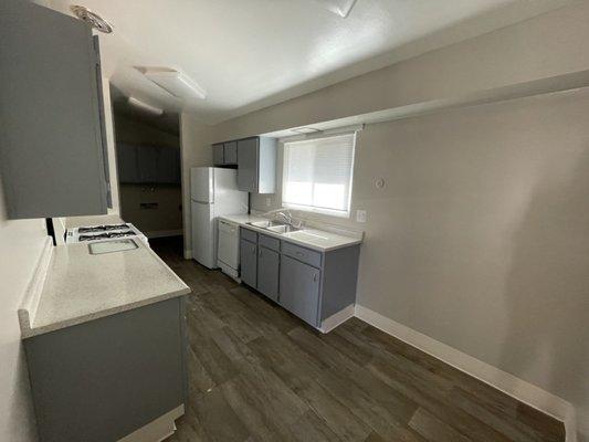 Updated (Floors only) Kitchen (prior the installation of washer and dryer)