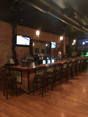 Our Bar with seats, Two TVs, and all the bar accessories.