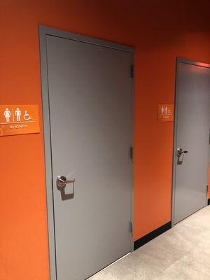 Showers, located across from restrooms, next to lockers.