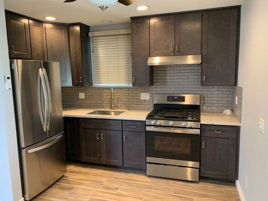 Accessory Dwelling Unit Kitchen Quartz countertop, backsplash, and porcelain flooring from Modern Stone