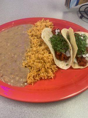 Two chorizo tacos, rice and beans