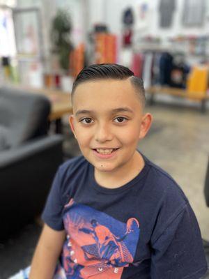 "Get your boys summer-ready with a fresh haircut! Visit us today for a cool new look they'll love."