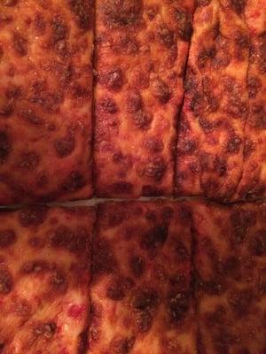 Overcooked cheese pizza.