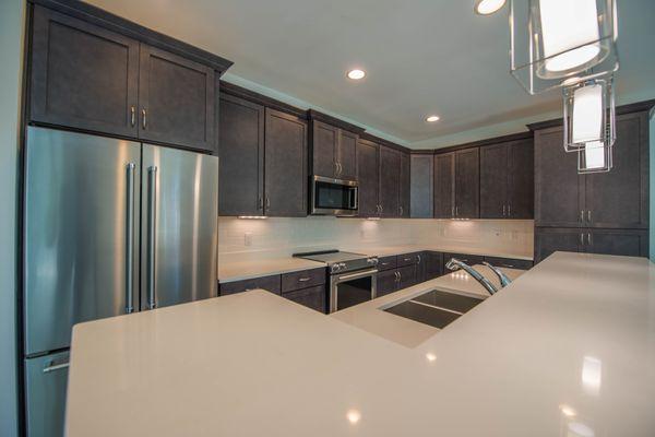 Quartz countertops with Kitchen appliance and custom wood cabinets