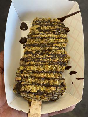 New Mexico United Paleta (Oreos & Banana) dunked in dark chocolate with pistachios.