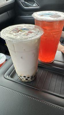 Coconut milk tea with classic boba and a strawberry fruit tea with fruity boba.