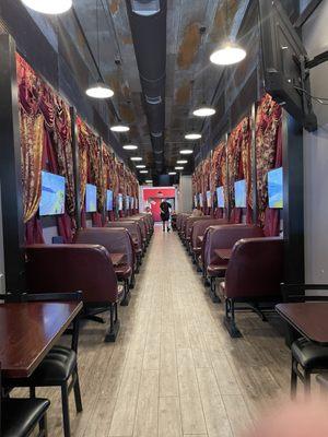 The restaurant looks like a Dining Car on a train and the screens on the walls have videos of beautiful scenery.