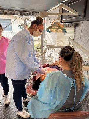 Dr. Gina volunteering with UCI Pre Dental Society providing free dental care to patients at the Santa Ana Boys and Girls Club.