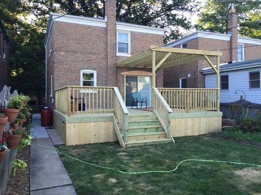 finished deck, pergola, and patio door