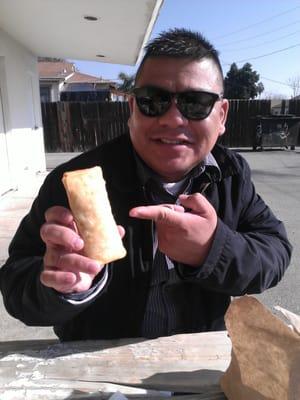 My foodie friend Rommel showing off his perfectly deep fried burrito.