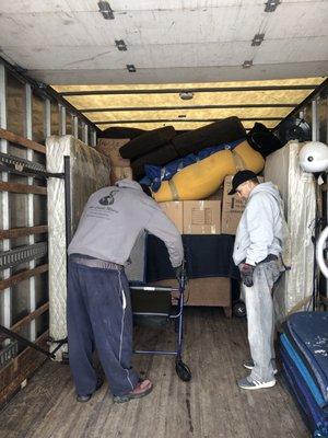 Shorty and Jamar packing the truck like Tetris masters.