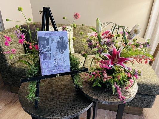 Japanese Ikebana style arrangement and floral adorned book stand. Gorgeous!