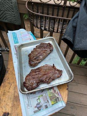 Strip steaks.