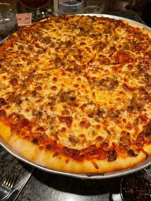 Thin crust sausage pizza