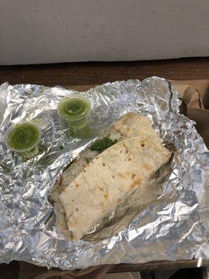 Carne asada burrito with green salsa