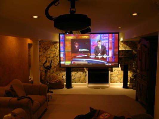 5.1 Surround sound home theater where screen retracts into ceiling.  Insatallation also includes recessed lighting...