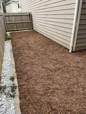 Backyard with "Yard Kid-Safe Playground mulch. Note strawberries on the side!