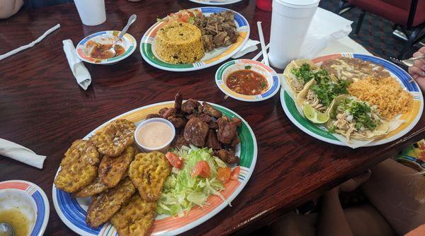 Fried plantains and fried pork, Chicken taco plate, rice with pigeon peas, pernil (pork) - all very good