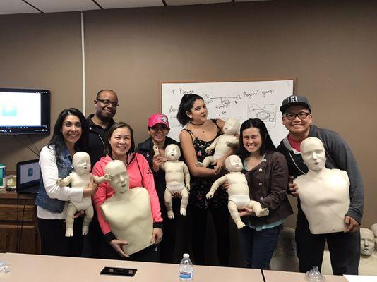 We all holding our significant manikins at the end of the course! Great CPR class with instructor Kevin !