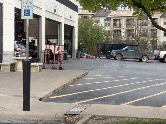 There are eleven hydraulic jacks in this photo. Apparently none of them can be used to swap out your tire for the spare.