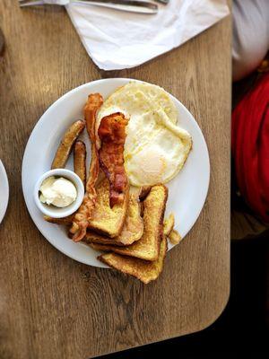 French toast combo with bacon and eggs over medium