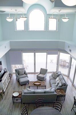 A 2 story condo on the Emerald Coast boasts of coastal design.