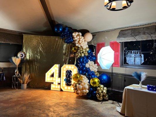 Backdrop, balloon garland and 40 marquee