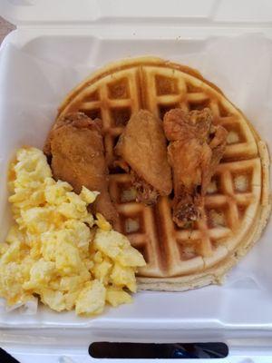 Chicken, waffles and scrambled eggs.