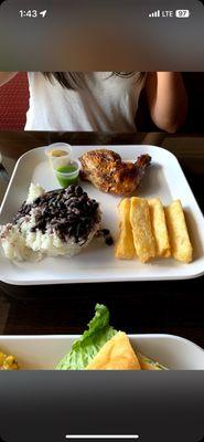 Yuca Fries, chicken, rice with black beans and some hot sauce