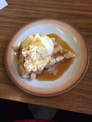 Apple pie warmed up with ice cream and caramel Yum