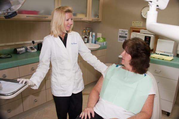 Dr. Downs consulting with a patient.