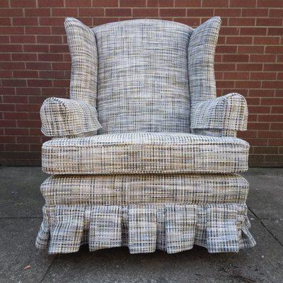 A Reupholstered Wingback Swivel Rocker