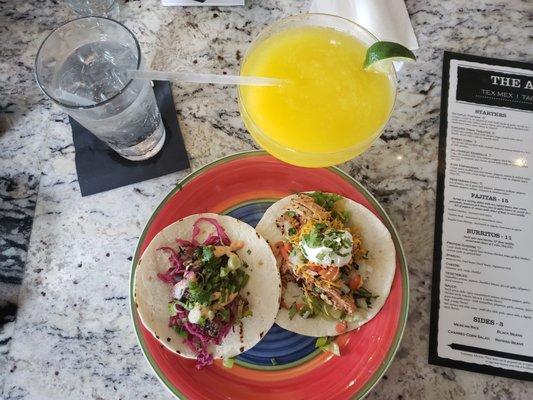 Eggplant and chicken tinga tacos with a frozen mango marg