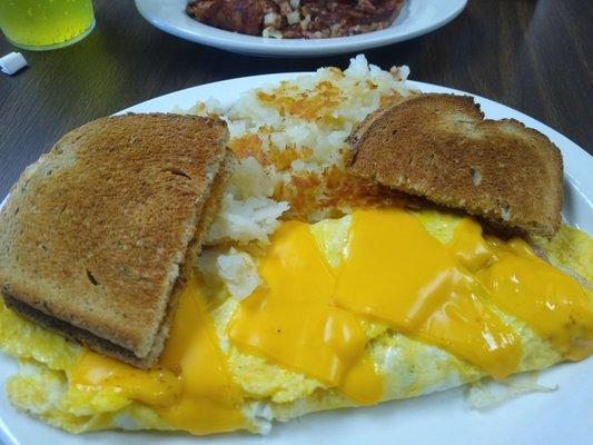 Western omelet with home fries and rye toast