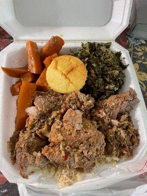 Country style rib plate. The ribs are on a bed of rice. Sides of yams and collard greens. Cornbread muffin included.