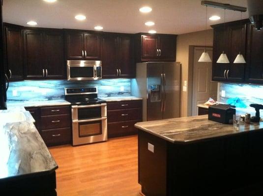 Kraftmaid Oak Peppercorn Belmont Square cabinets. Formica Dolce Vita countertops