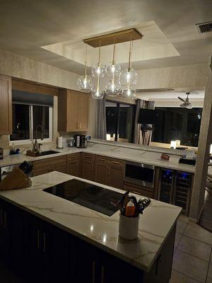 Complete kitchen remodel: cabinets, lighting, quartz & plumbing.