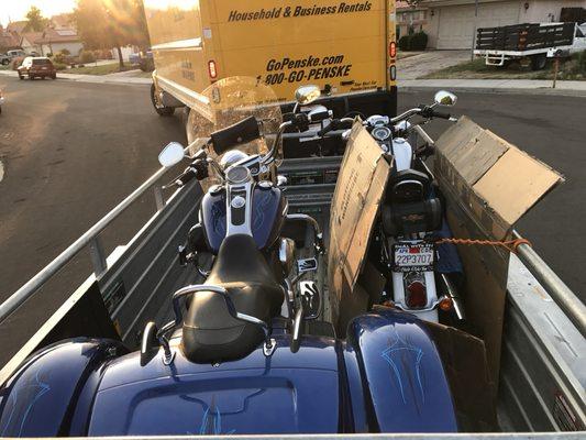 Tricycle and motorcycle have been loaded into one trailer. Perfect job!