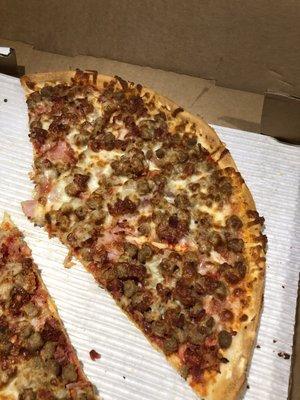 Meat madness pizza