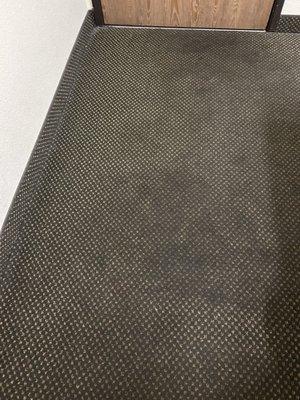 Carpet is black throughout and keep your shoes on.