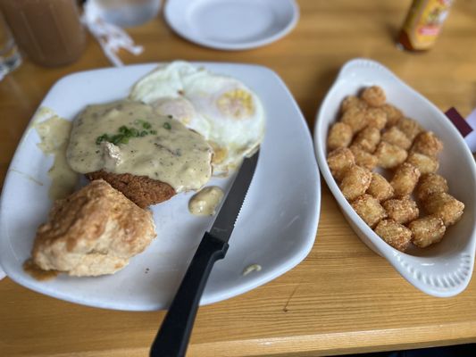 Country fried steak with tater tots and biscuit