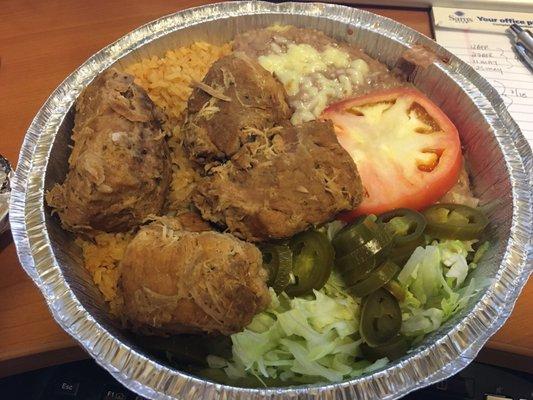 Carnitas, rice and beans.