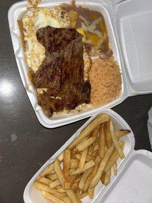 Chilaquiles plate and side of fries cook to order  really hot and fresh.