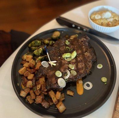 Ribeye with roasted potatoes tossed in duck fat