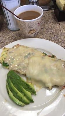 Swiss cheese , ham , pepper omelette. With avocado on the side.