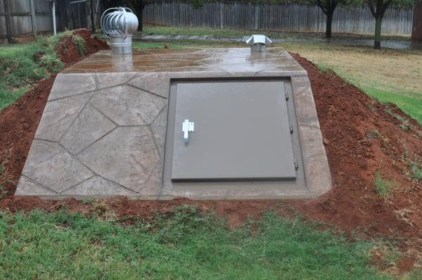 Newly Installed Brown Flagstone Below Ground Storm Shelter We Installed.