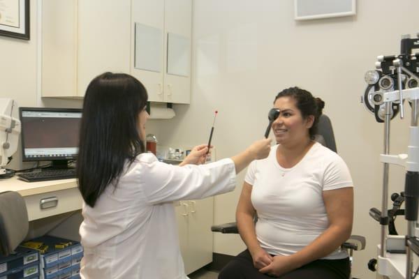 Dr. Tang is doing a cover test on a patient