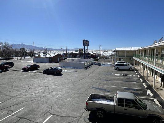 Parking lot and defunct swimming pool.