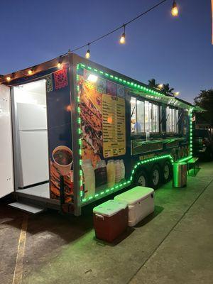 Food truck with menu board.